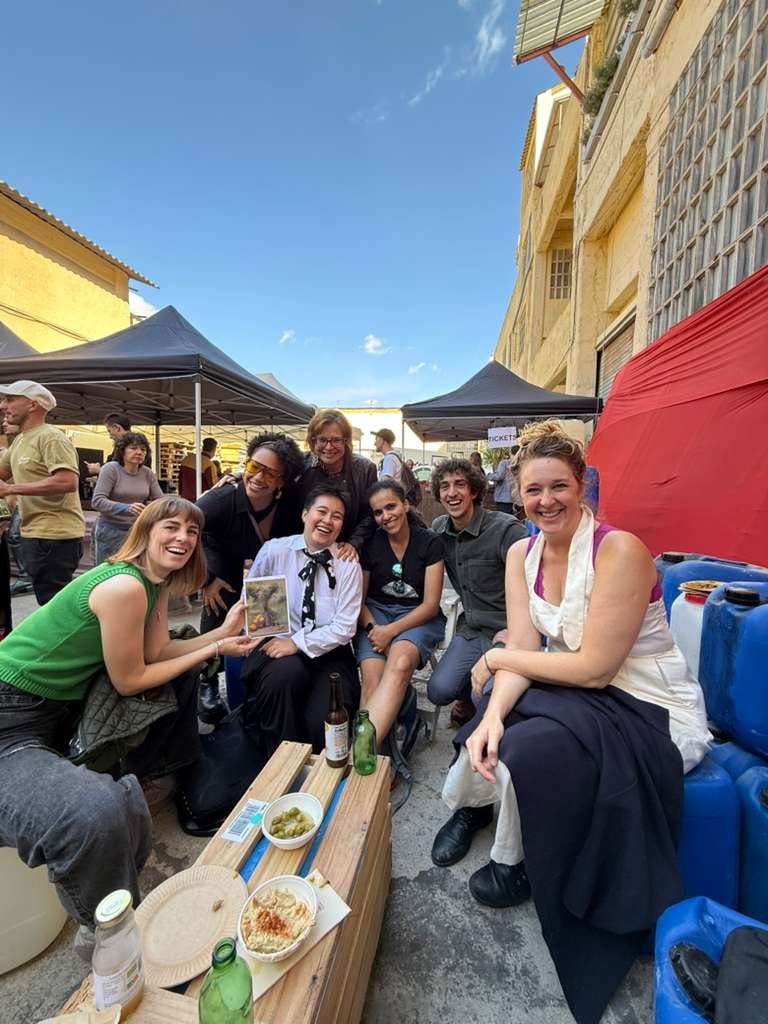 Art collectors viewing oil on canvas paintings at Barcelona open studio event