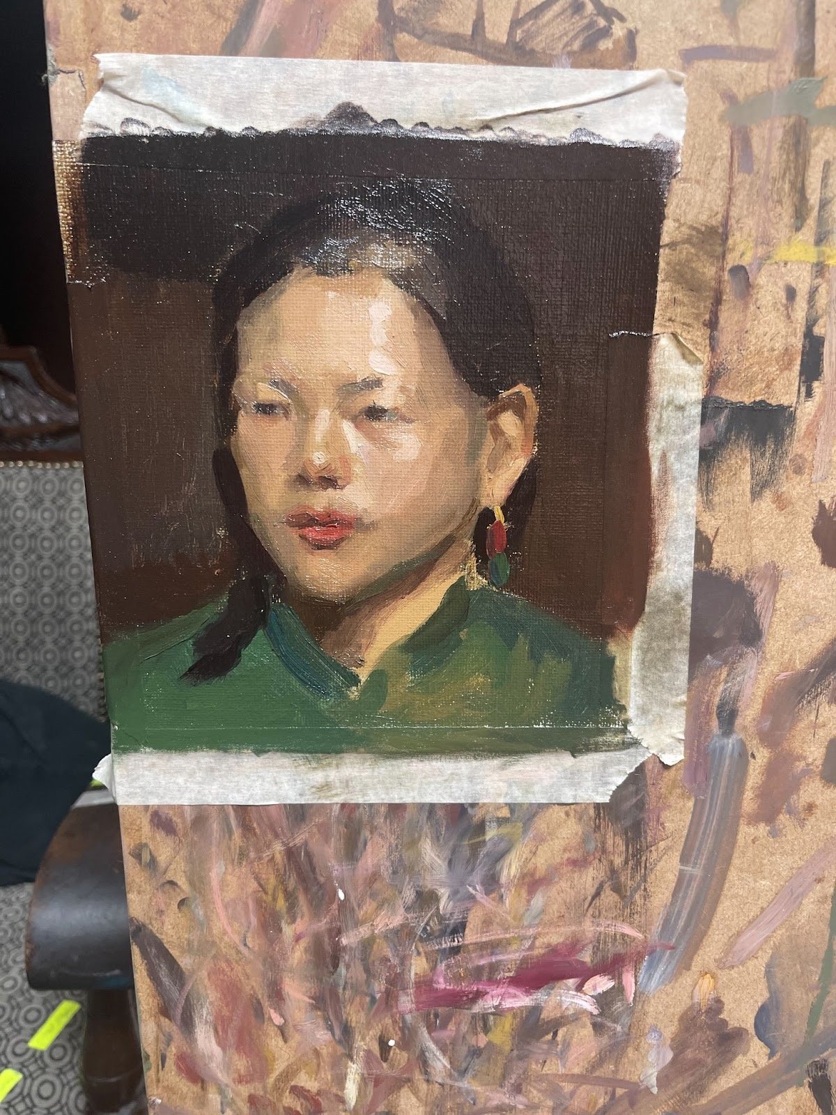 Small oil colour study of Jie, painted on canvas and pinned to the palette board