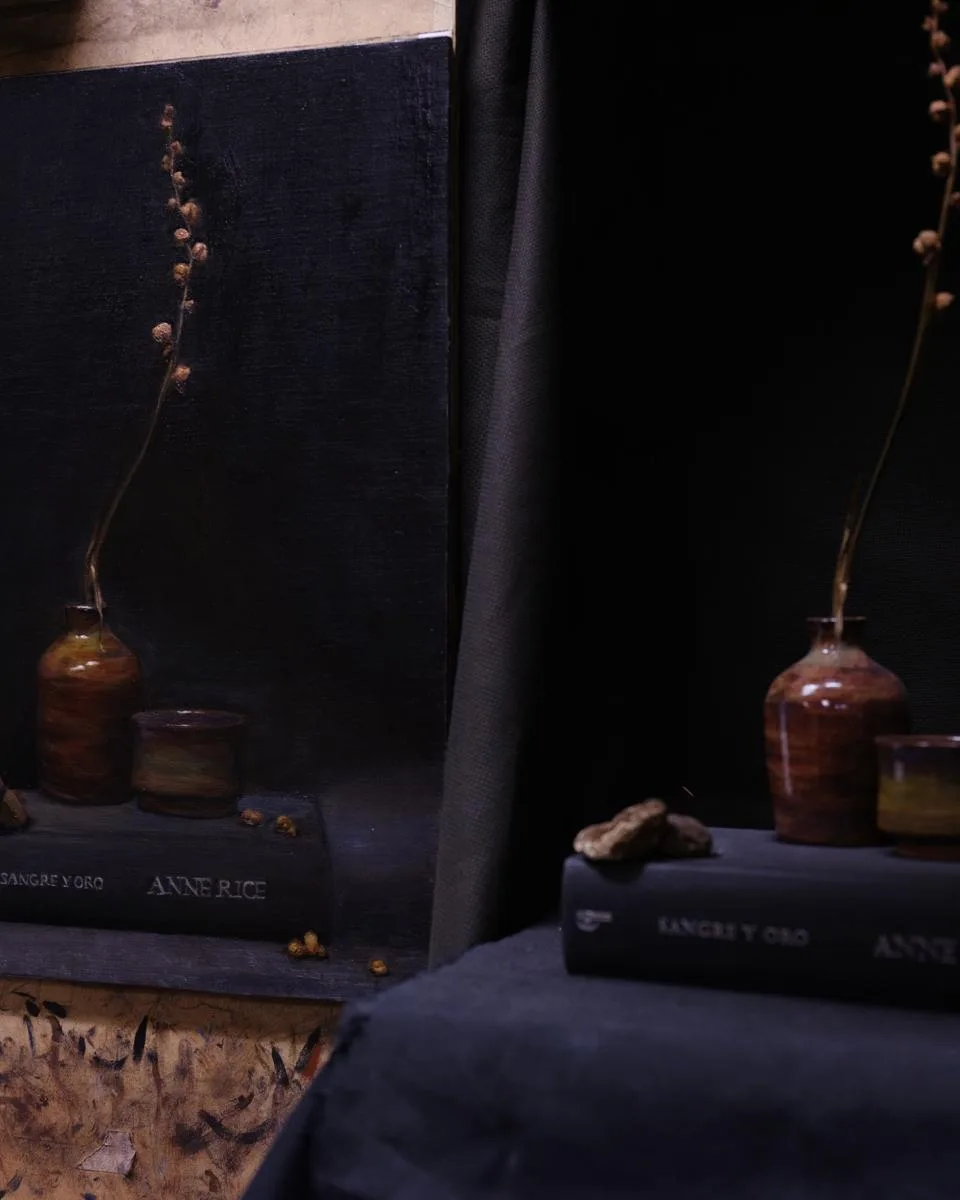Sangre y Oro, oil on linen still life with Anne Rice book, ceramic vessel, and dry blossom. T. Cheung-Damonte, 2024.
